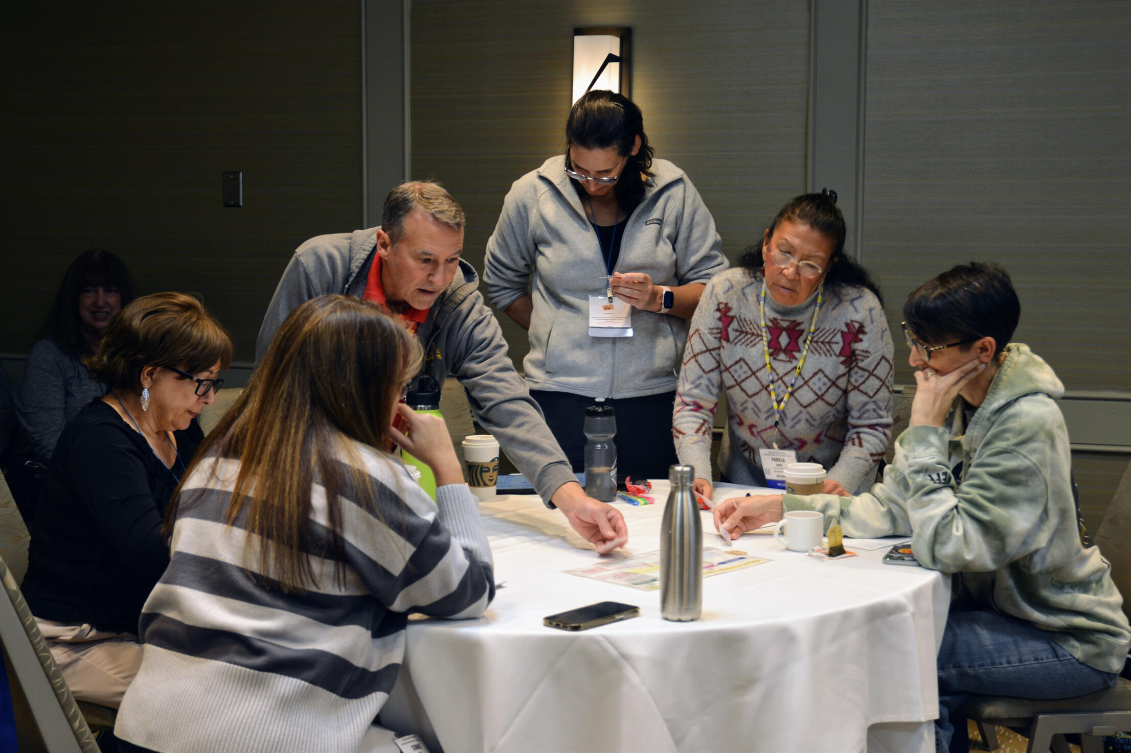 small group of workshop participants engaging in a session by Aaron Barlin at Elynndí: Learning and Development, Led by a Teacher